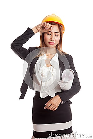 Tried Asian engineer woman with blueprints Stock Photo