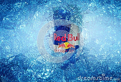 TRIESTE, ITALY-MAY 29, 2016: Aluminium can of Red Bull Energy drink iced Background. Editorial Stock Photo