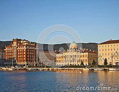 Trieste, Italy, Rive at sunset with neo-classical Carciotti pala Stock Photo