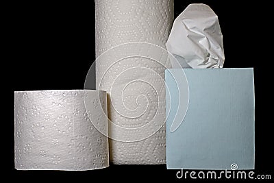 Trifecta of essential pandemic paper products including toilet tissue, facial tissues, and paper towels. Stock Photo