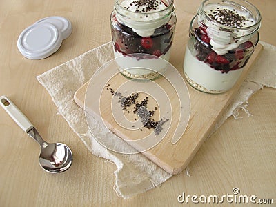 Trifle with strained yogurt, berries and chia seeds Stock Photo