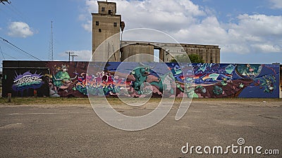 `Trigger Fingers` sign and one of many large murals created during a three Day mural painting event in March 2022 in Deep Ellum. Editorial Stock Photo