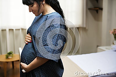 A trimester pregnant woman Stock Photo