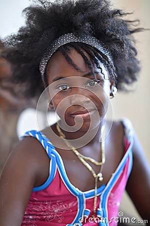 Trinidad, Cuba, August 15th, 2018: Little cuban girl posing at home Editorial Stock Photo