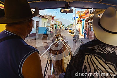 Trinidad town in Cuba. Horse carriage with cowboy Editorial Stock Photo