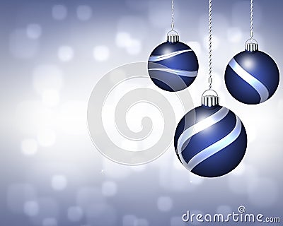 Trio of Blue and Silver Christmas Ornaments on Twinkling Background Stock Photo