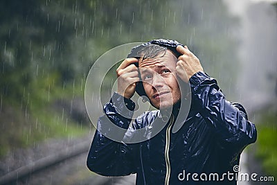 Traveler in heavy rain Stock Photo