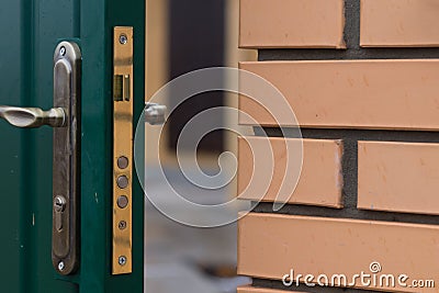 Triple security lock on a new door Stock Photo