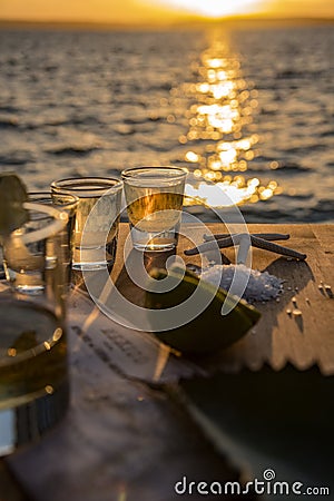 Triple shots of tequila by the sea Stock Photo