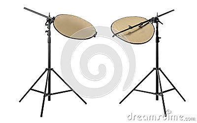 Tripods with reflectors on white background. Professional photographer`s equipment Stock Photo