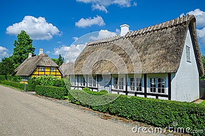 Troense, Denmark - June 26, 2016: Two idyllic half-timbered houses with thatched roof on a sunny day in the town Editorial Stock Photo