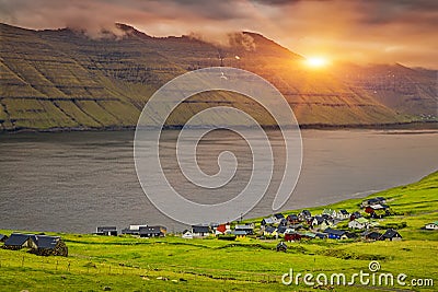 Trollanes Village, Kalsoy Island, Faroe Islands, Sunrise Over Mountain Stock Photo