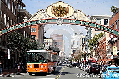 Trolley Bus Driving through the Gaslamp Quarter in San Diego Editorial Stock Photo