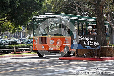 Trolley Bus Driving out of Seaport Village in San Diego Editorial Stock Photo