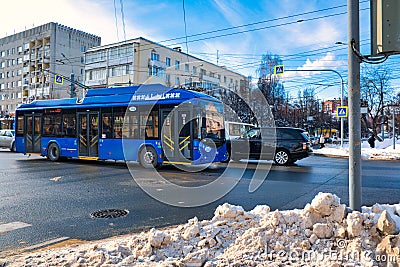 The trolleybus is moving along the street, in the city of Yoshkar-Ola. Editorial Stock Photo