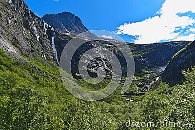 Trollstigen or the Trolls Road which consists of 11 hairpin bends in Rauma Municipality, MÃ¸re og Romsdal County, Norway. Stock Photo