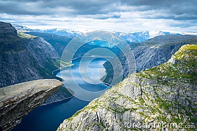 Trolltunga in Norway cliffs mountain and lake fiord Stock Photo