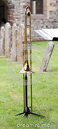 Trombone in a churchyard Stock Photo