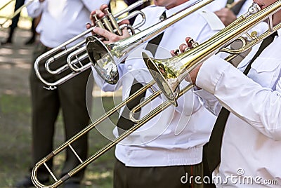 Trombone players of military brass band Stock Photo