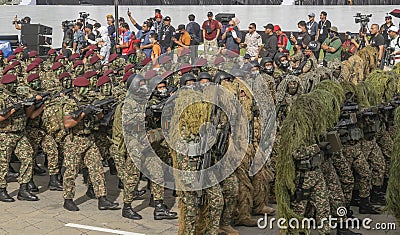 Malaysian Army paratrooper troop marching during 65th Malaysia National Day Parade in Kuala Lumpur. Editorial Stock Photo
