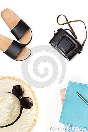 Tropical vacation planning. Straw beach sunhat, sunglasses, map, camera on white. Top view with copy space. Summer. Stock Photo