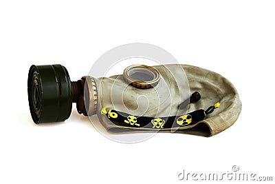 trophies of the stalker: old Russian gas mask, rusty nail and yellow-black baubles on a white background. Stock Photo