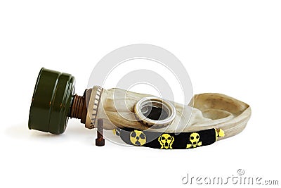trophies of the stalker: old Russian gas mask, rusty nail and yellow-black baubles on a white background. Stock Photo