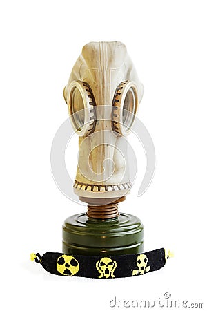 trophy stalker old Russian gas mask and yellow-black baubles on a white background. concept of stalking. Isolated. Stock Photo