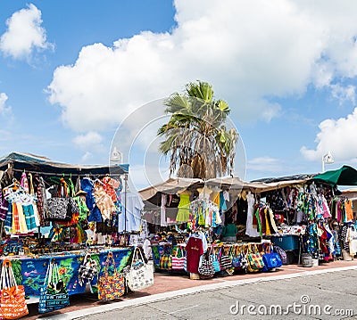 Tropical Bags and Shirts at a Market Editorial Stock Photo