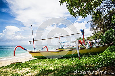 Tropical beach and local boat in Bali Stock Photo