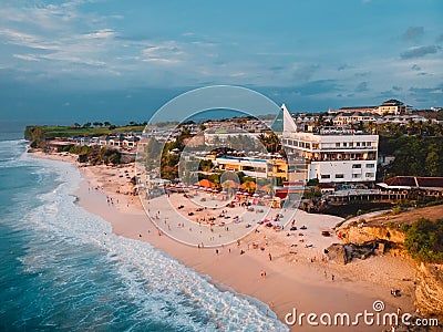 Tropical beach with ocean. Dreamland beach with sunset tones in Bali. Aerial view Stock Photo