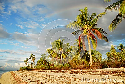 Tropical beach with rainbow Stock Photo