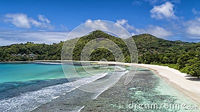 Tropical beach with sea and palm taken from drone. Beach and sea photo. Romantic beach aerial view Stock Photo