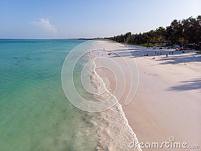 Tropical beach with white sand Bordered with torquoise Ocean in Zanzibar, Paje beach. Tanzania Stock Photo