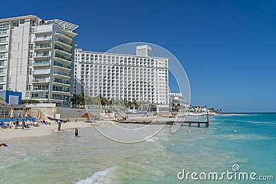 Tropical beach with wooden pier at Playa Caracol, Boulevard Kukulcan, Hotel Zone, Cancun, Mexico Editorial Stock Photo