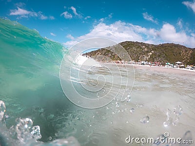 Tropical blue surfing wave in Brazil Editorial Stock Photo