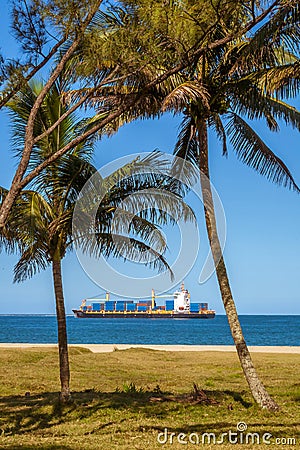 Tropical cargo ship Stock Photo