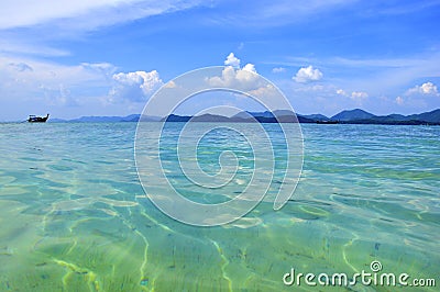 tropical exotic beach clouds and boat Stock Photo