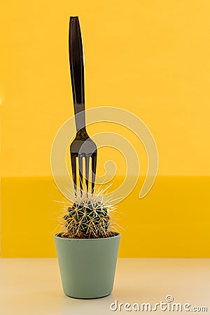 Tropical fashion cactus and black fork on yellow background. Trendy minimal pop art style and colors.summer trendy Stock Photo