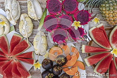 Tropical fruits assortment, closeup, top view. Many colorful ripe fruits background. Durian, papaya, watermelon, banana, Stock Photo