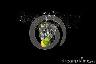 Tropical fruits lemon and lime in water Stock Photo
