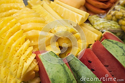 Tropical fruits. Prepared pineapple and watermelon slides Stock Photo