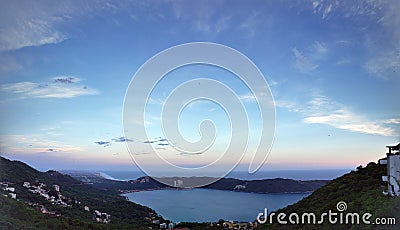 tropical landscape in the bay of Puerto Marques in Acapulco, Mexico at sunset Stock Photo