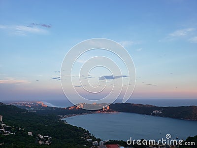 tropical landscape in the bay of Puerto Marques in Acapulco, Mexico at sunset Stock Photo