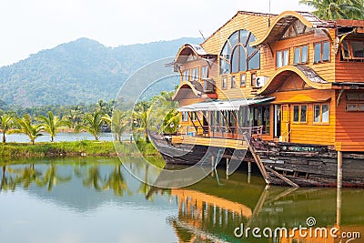 Tropical landscape. Wooden house in the form of a boat on the ocean Travel and tourism in Asia Stock Photo