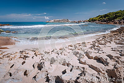 Tropical old coral coastline of remote beach with unique granite rocks, of Grand L Anse, La Digue, Seychelles Stock Photo
