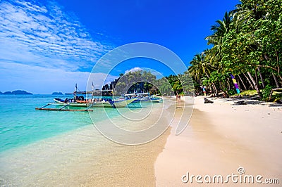 Tropical Papaya beach at paradise coast, El Nido, Palawan, Philippines. Tour A Route. Coral reef and sharp limestone cliffs Stock Photo