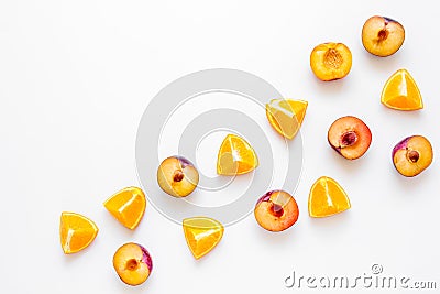 Tropical peach and orange fruits for fresh juice white background top view space for text Stock Photo