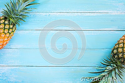 Tropical pineapple on wood plank blue color. Stock Photo