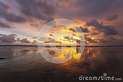 Tropical sandy beautiful beach of Kuta in Bali at sunset. Indonesia Stock Photo